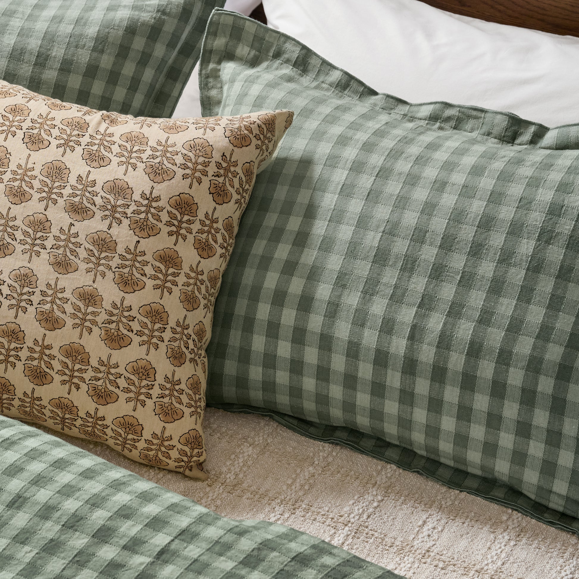 Maxine Gingham Duvet Cover in dusty green shown on bed with coordinating shams
