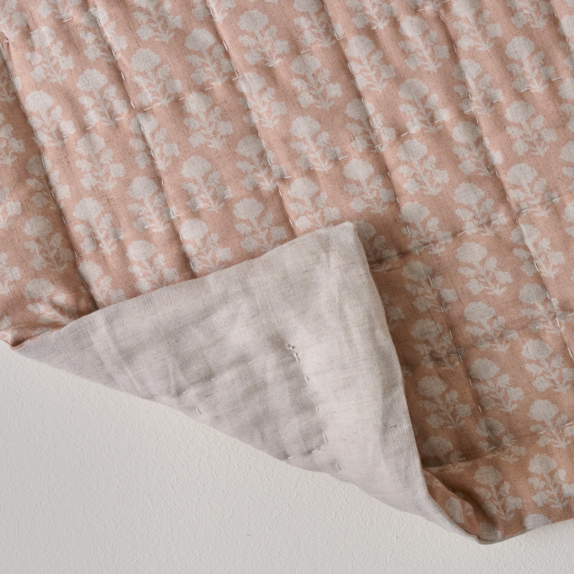 Ellie Block Print Quilt shown with folded corner