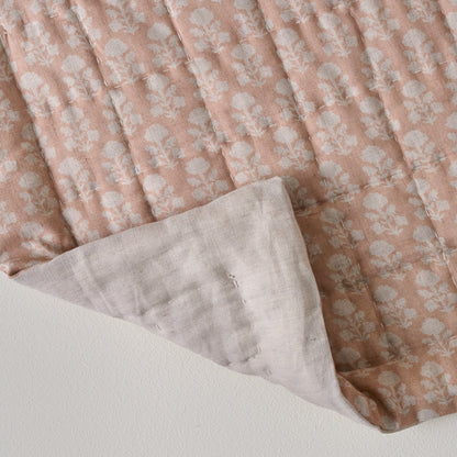 Ellie Block Print Quilt shown with folded corner