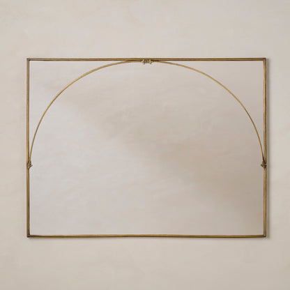 Decorative Vienna Mantle Mirror with a gold frame on a beige wall