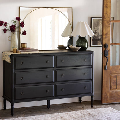 Vienna Mantle Mirror hung over black dresser in entryway