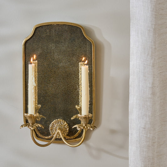 Maven Mirrored Double Wall Sconce shown styled with taper candles