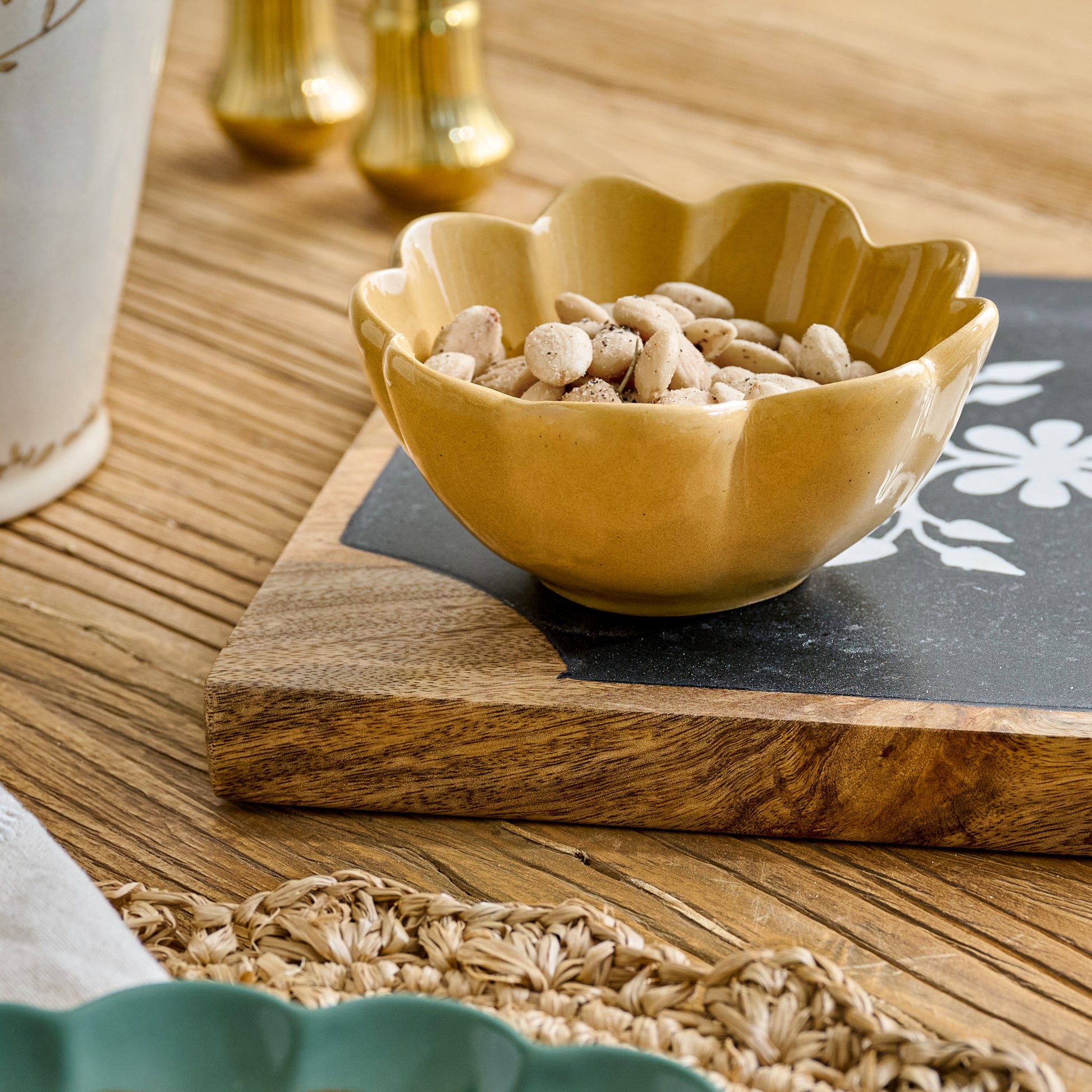 Ochre Scalloped Mini Bowl shown with nuts