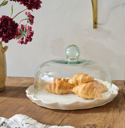 French White Ruffle Cake Plate + Dome shown with croissants