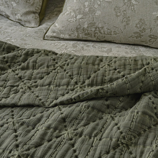Sutton Winter Moss Matelasse Coverlet shown on bed up close