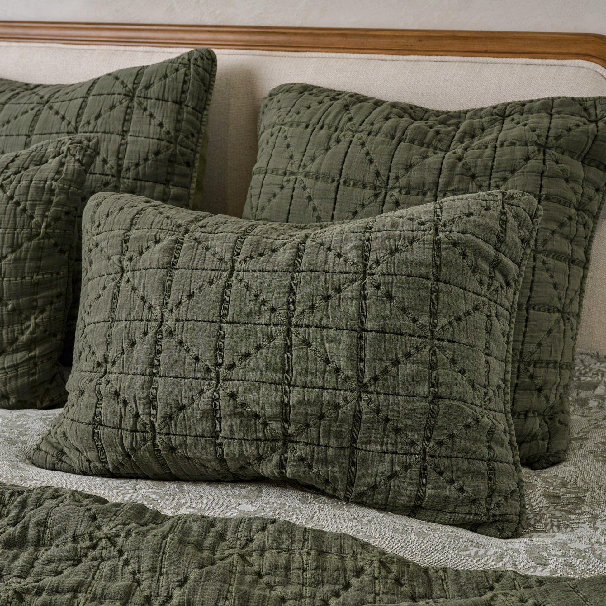 Sutton Winter Moss Matelasse Shams shown on bed