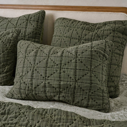 Sutton Winter Moss Matelasse Shams shown on bed