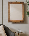 Penelope Wood and Brass Swivel Mirror shown on wall in room