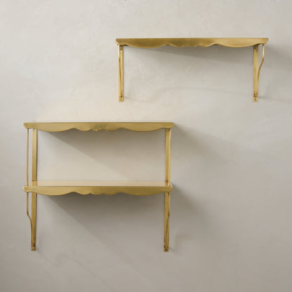 Rosalie Double Brass Scalloped Shelf shown on wall with single shelf
