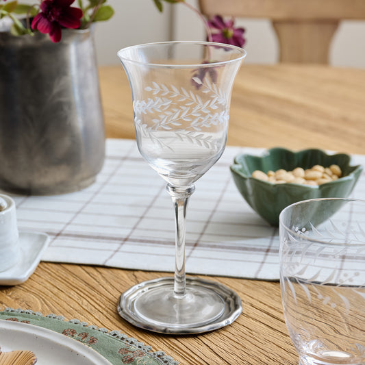 Vintage-Inspired Etched Glass Wine Glass shown on dining table