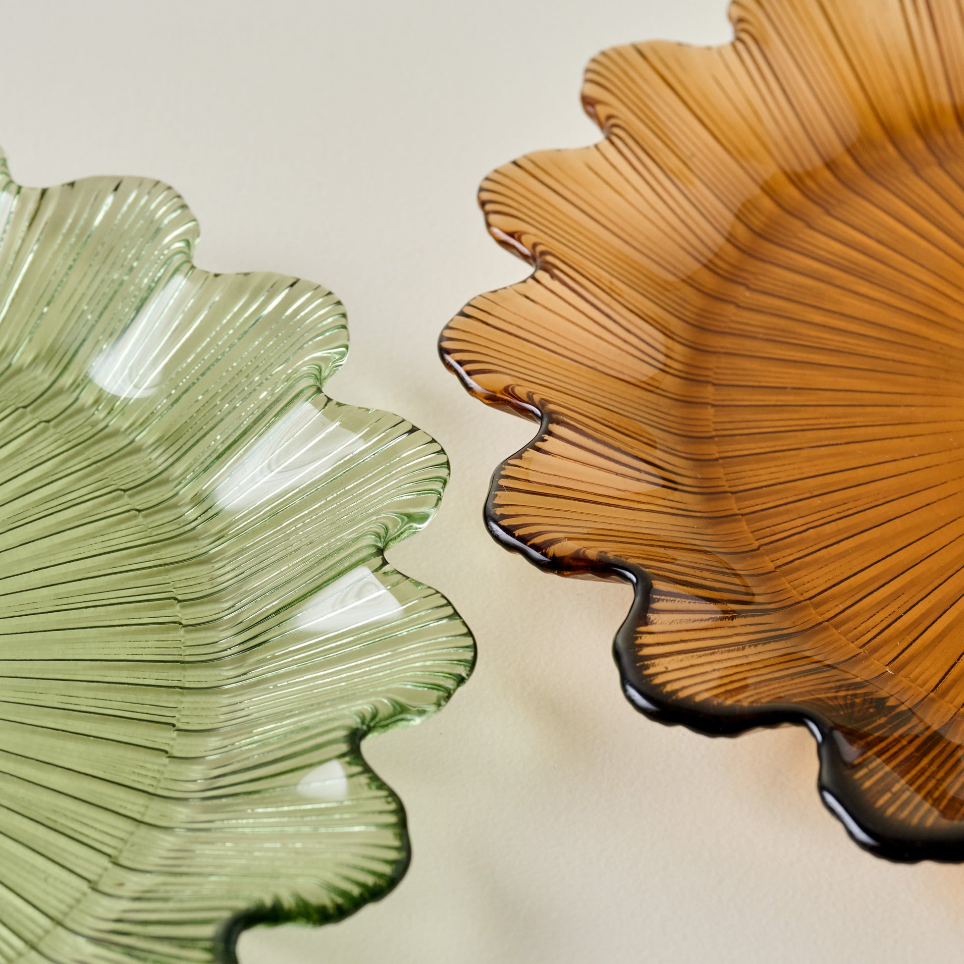 Emmeline Amber Scalloped Glass Plate shown with green scalloped plate