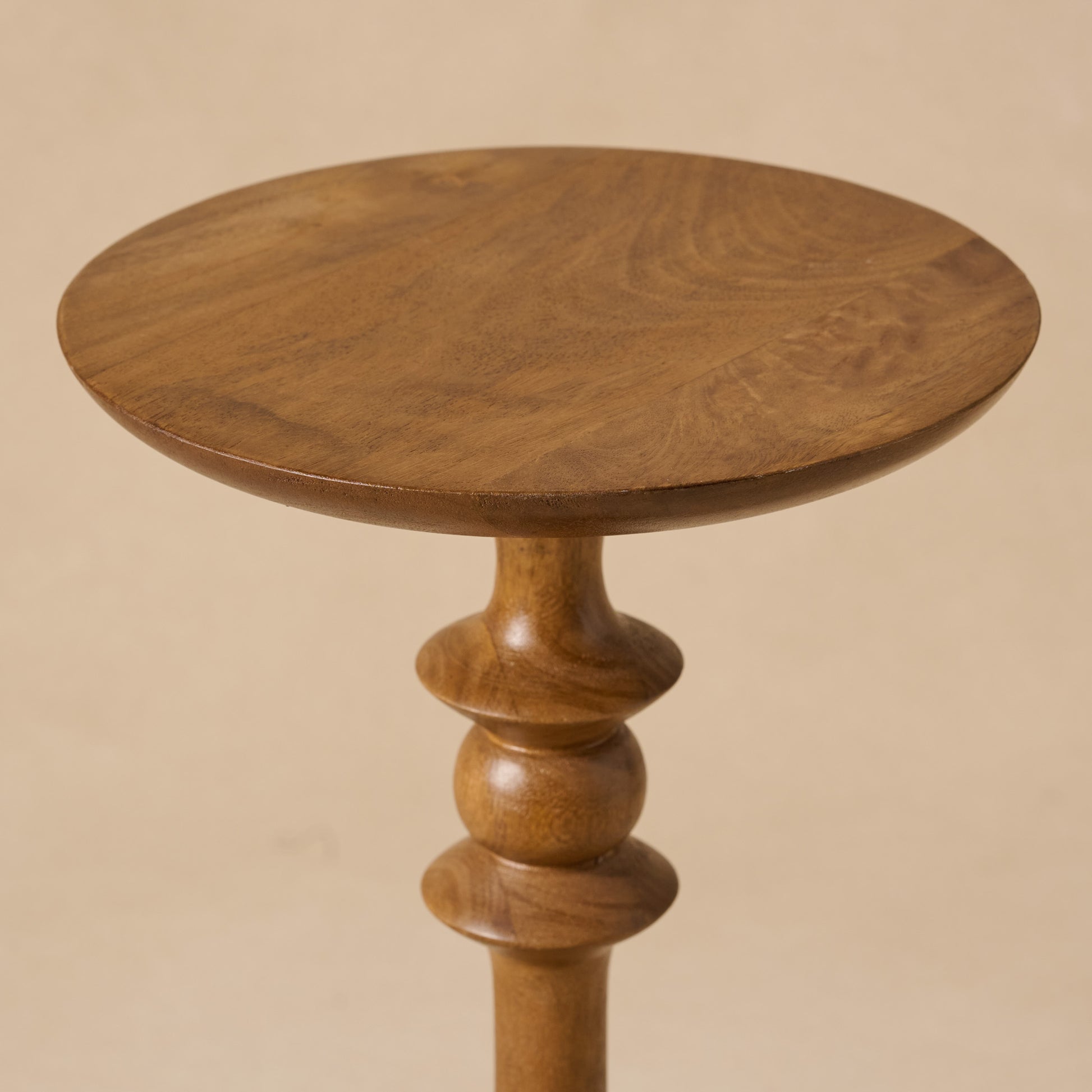 Enzo Turned Wood Cocktail Table  in Honey Mango tabletop up close