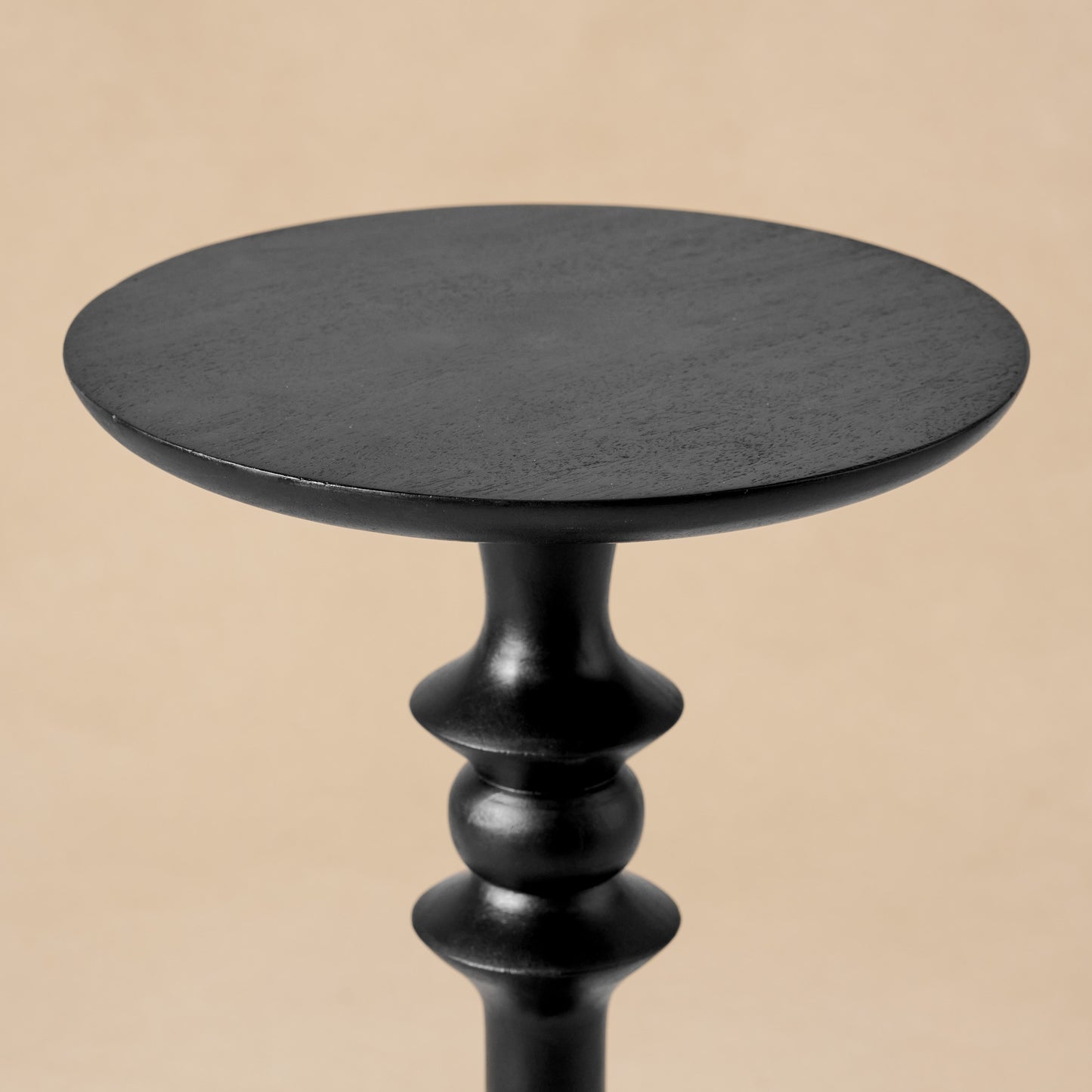 Enzo Turned Wood Cocktail Table in black close up