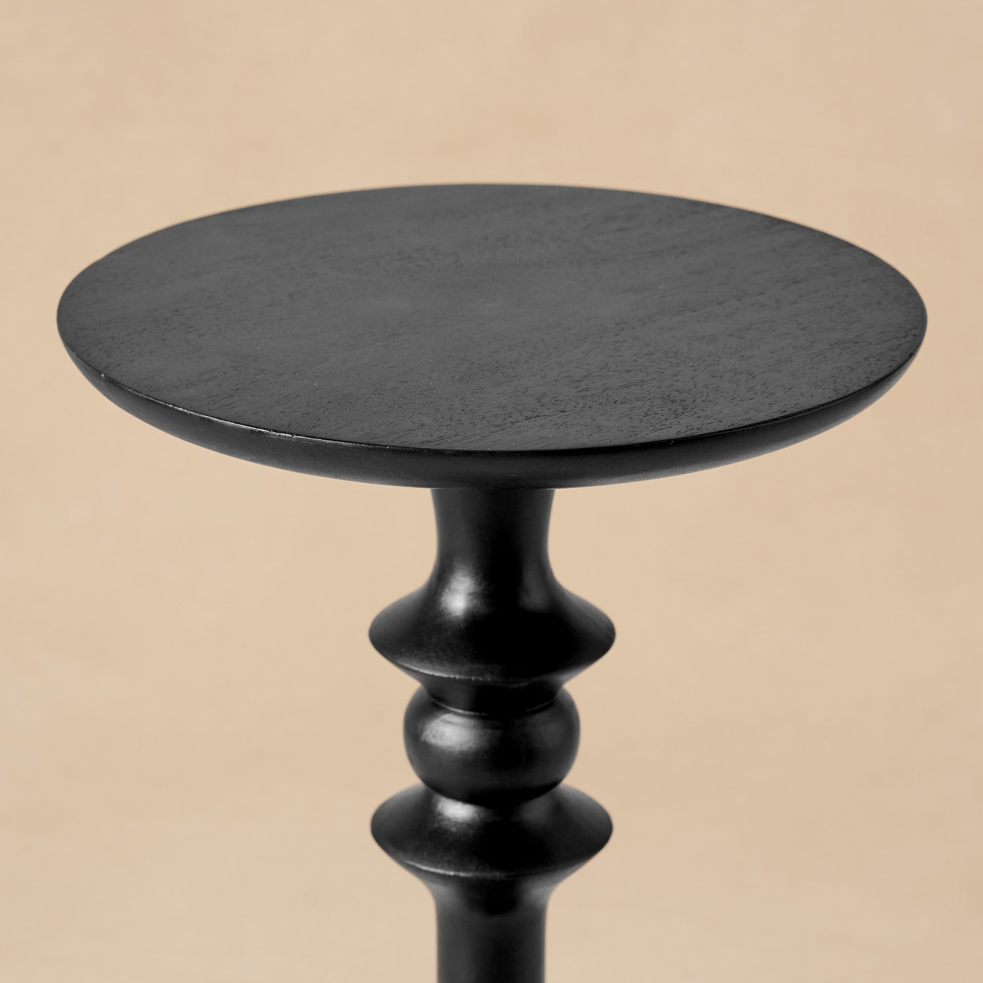 Enzo Turned Wood Cocktail Table in black close up