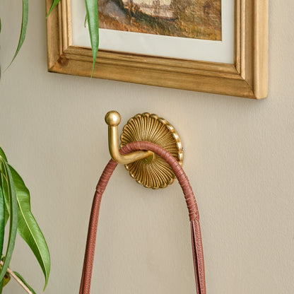 Shiloh Solid Brass Wall Hook shown styled on wall