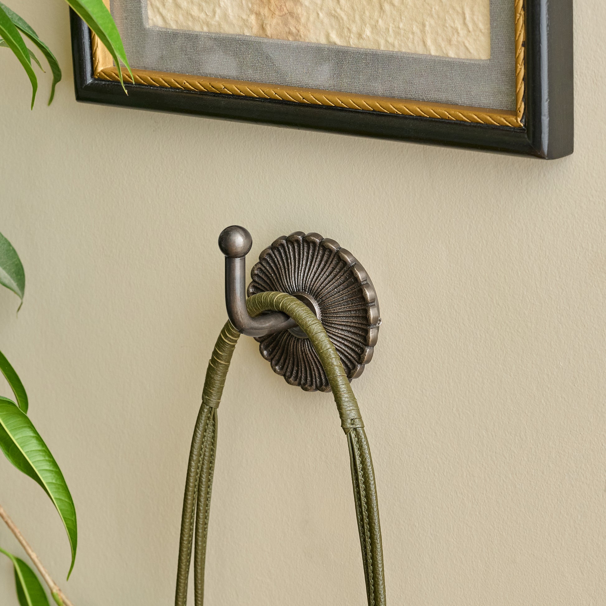 Shiloh Antiqued Bronze Wall Hook shown styled on wall