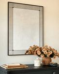 Francis Antiqued Framed Mirror shown hung above dresser
