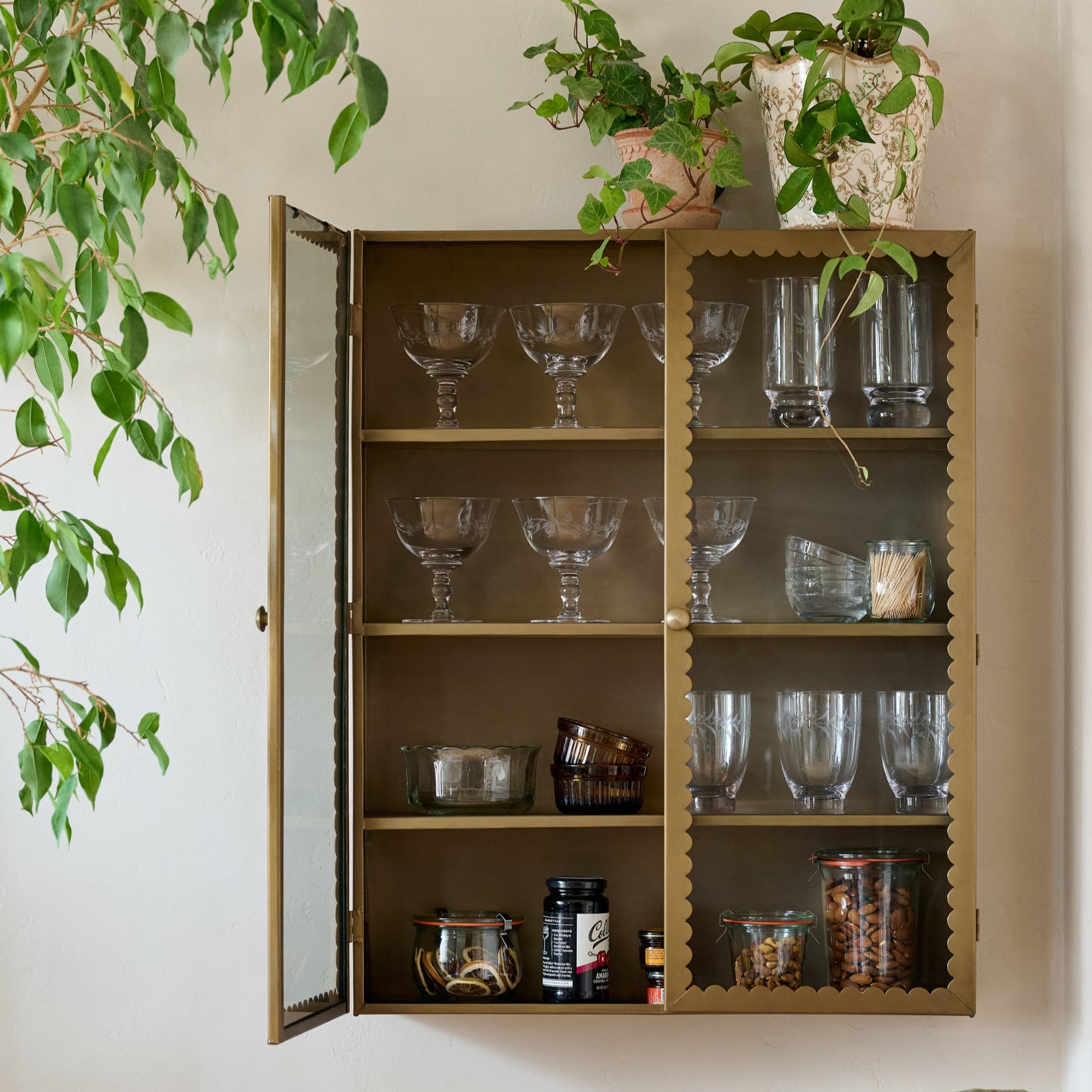 Dottie Brass Scalloped Display Cabinet shown styled on wall