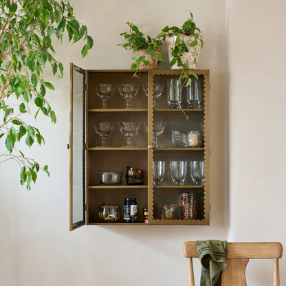 Dottie Brass Scalloped Display Cabinet shown styled on wall