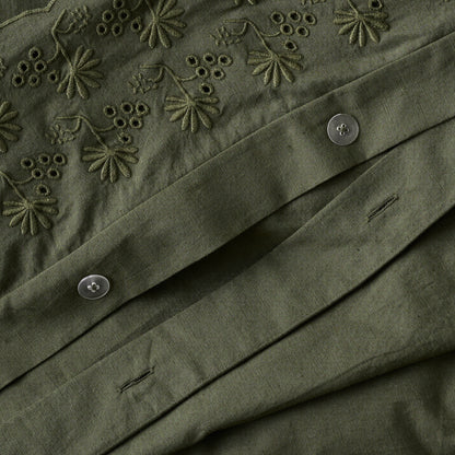 Clara Eyelet Flange Duvet Cover in color Olive Night button closure up close