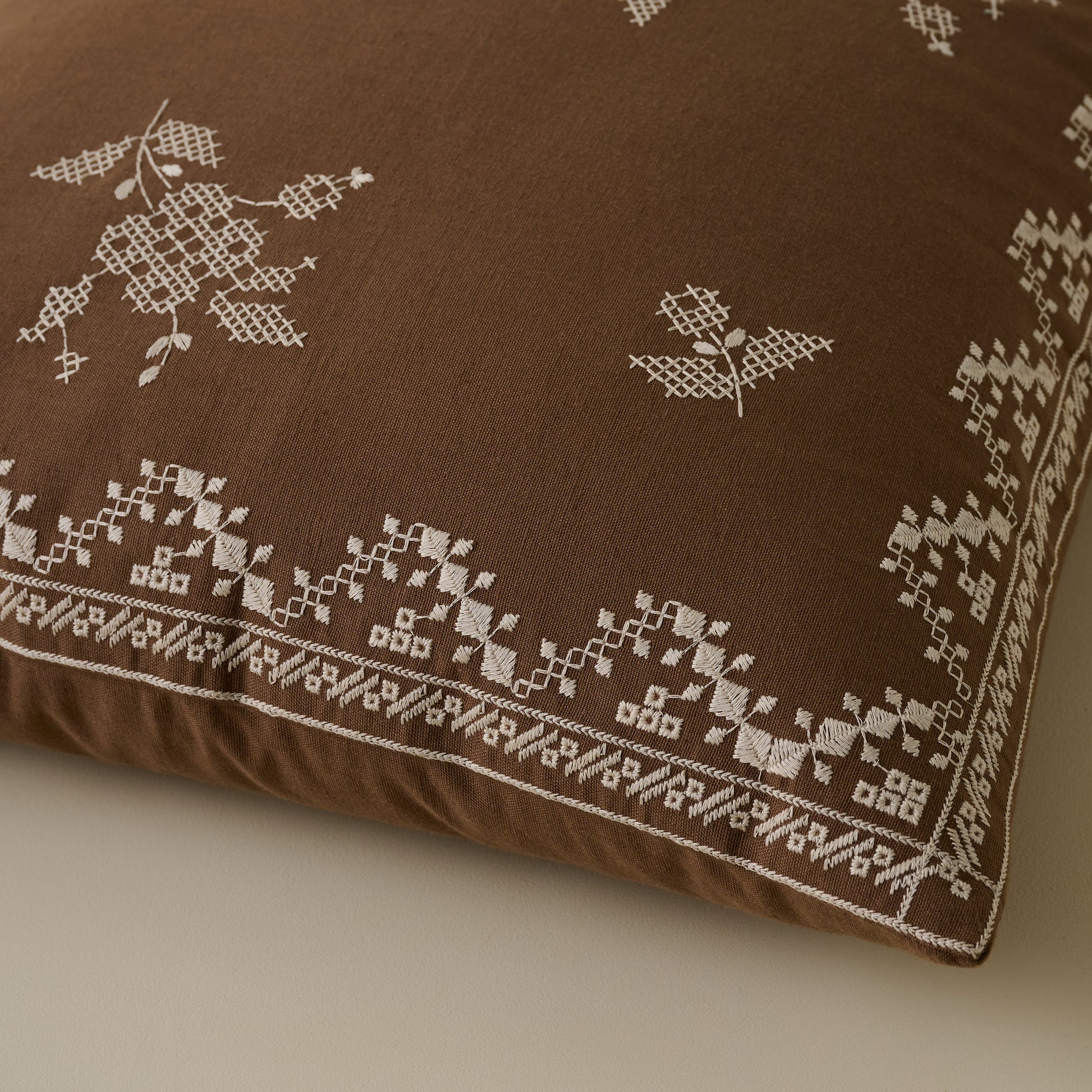 Lacey Embroidered Throw Pillow corner up close