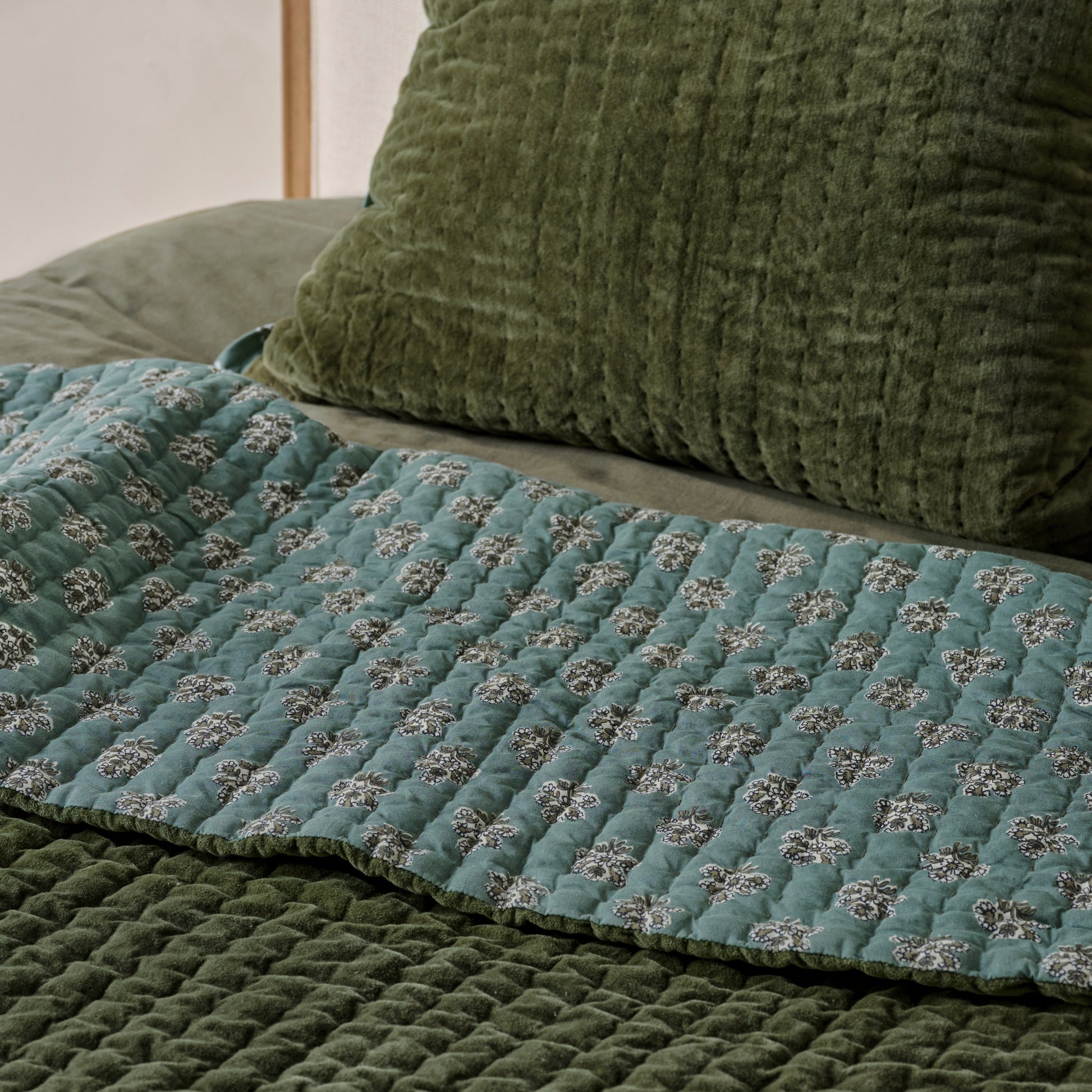 Audrey Velvet Block Print Quilt - Winter Moss shown on bed turned to show reversible sides