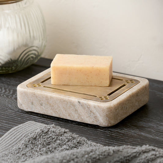 Quincey Marble and Brass Inlay Soap Dish in beige shown with bar of soap