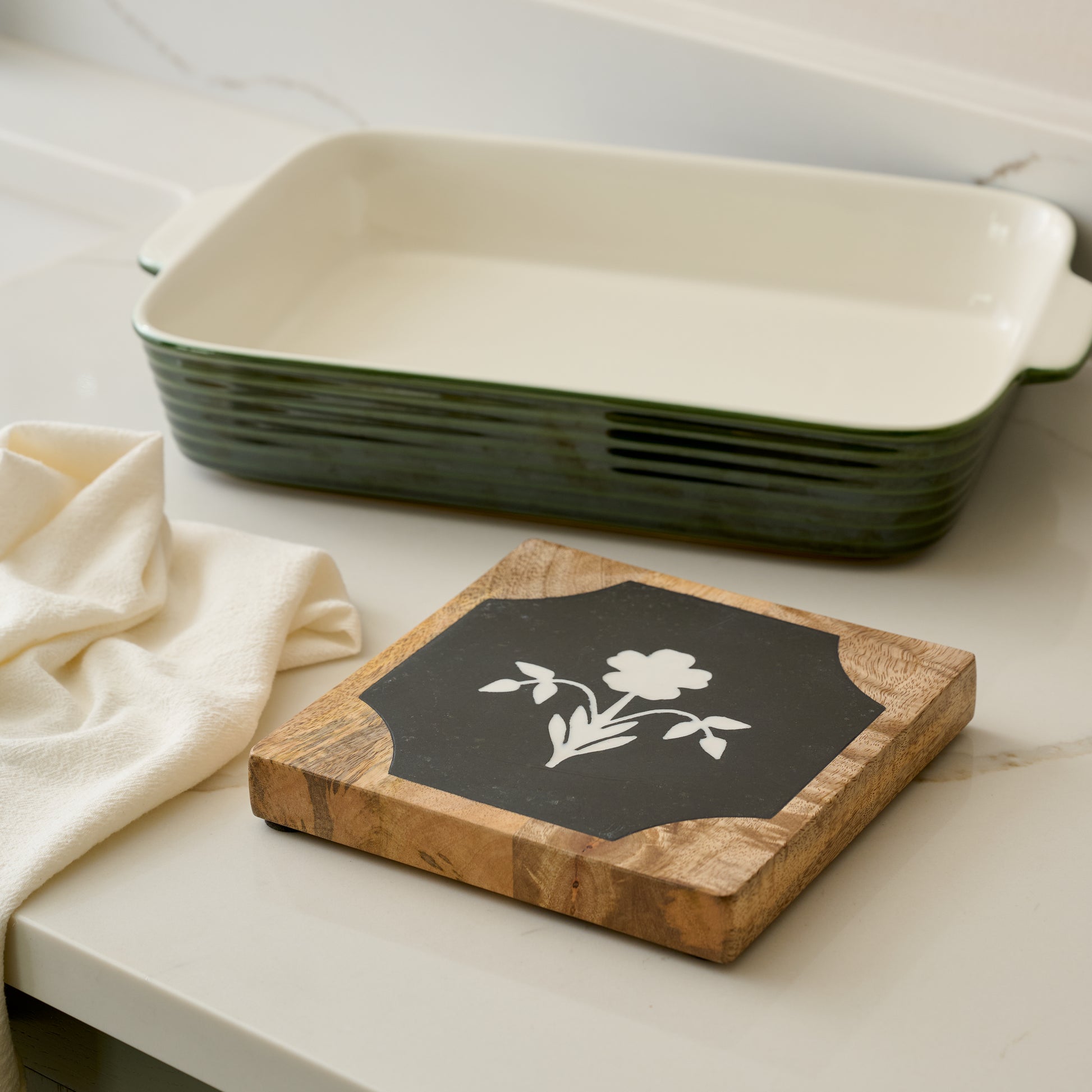 Elenora Marble Trivet shown with baking dish