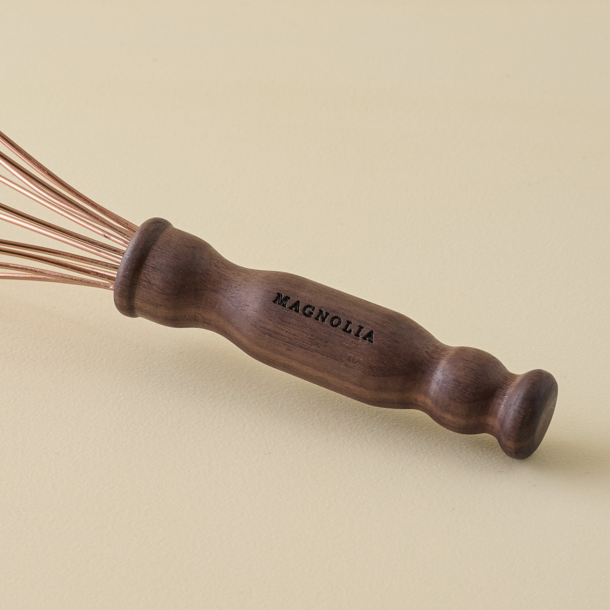 Copper + Walnut Whisk zoomed in with 'Magnolia' etched on handle