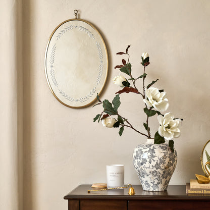 Juliet Etched Oval Mirror shown hung on wall