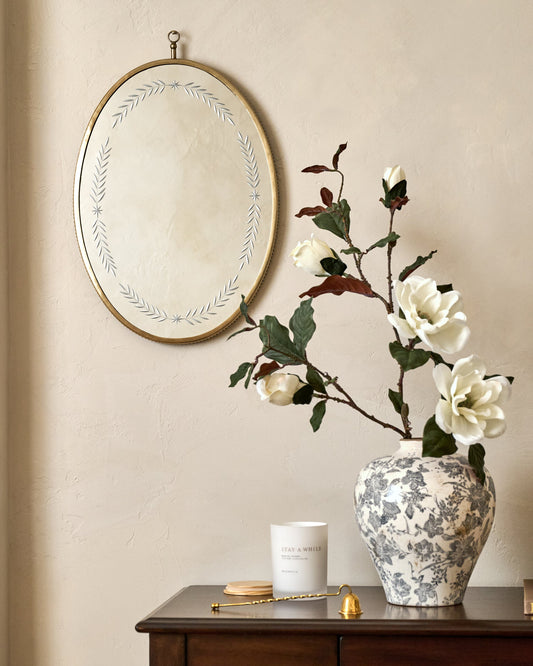 Juliet Etched Oval Mirror shown hung on wall