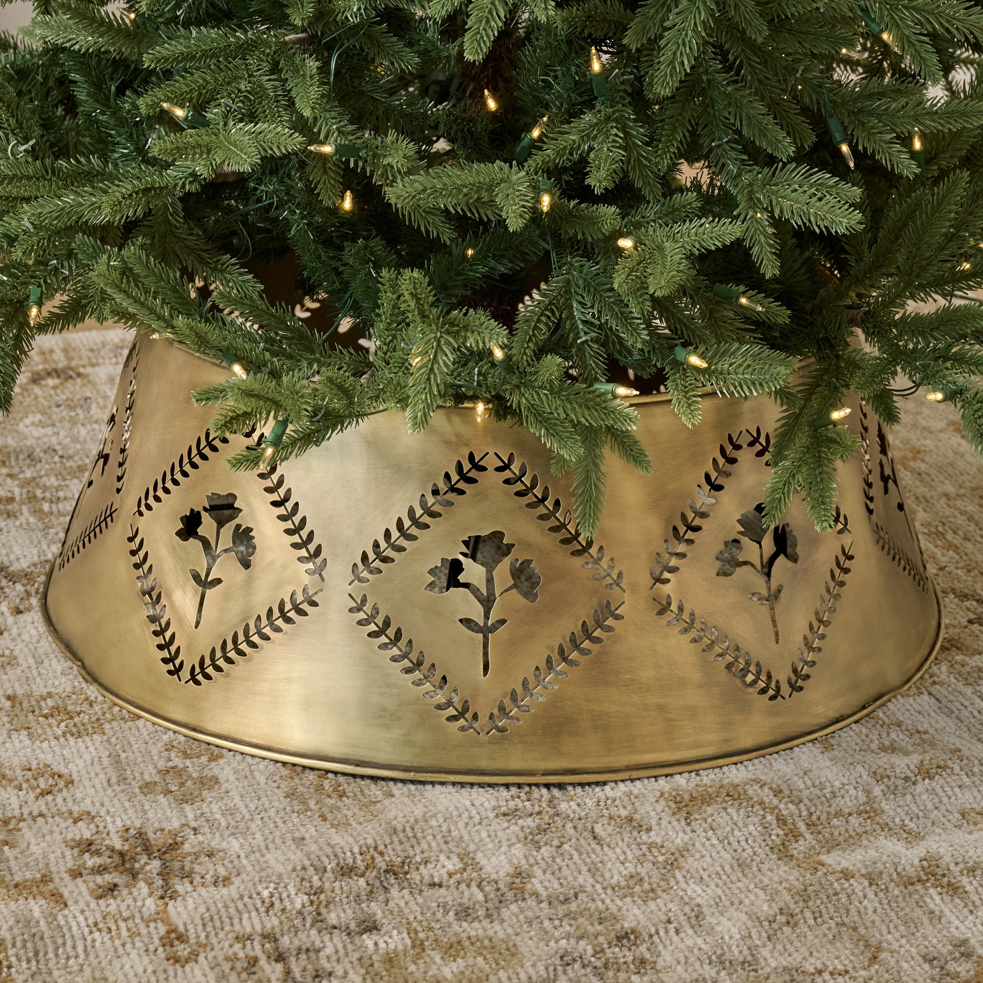 Antique Brass Floral Tree Collar shown under tree