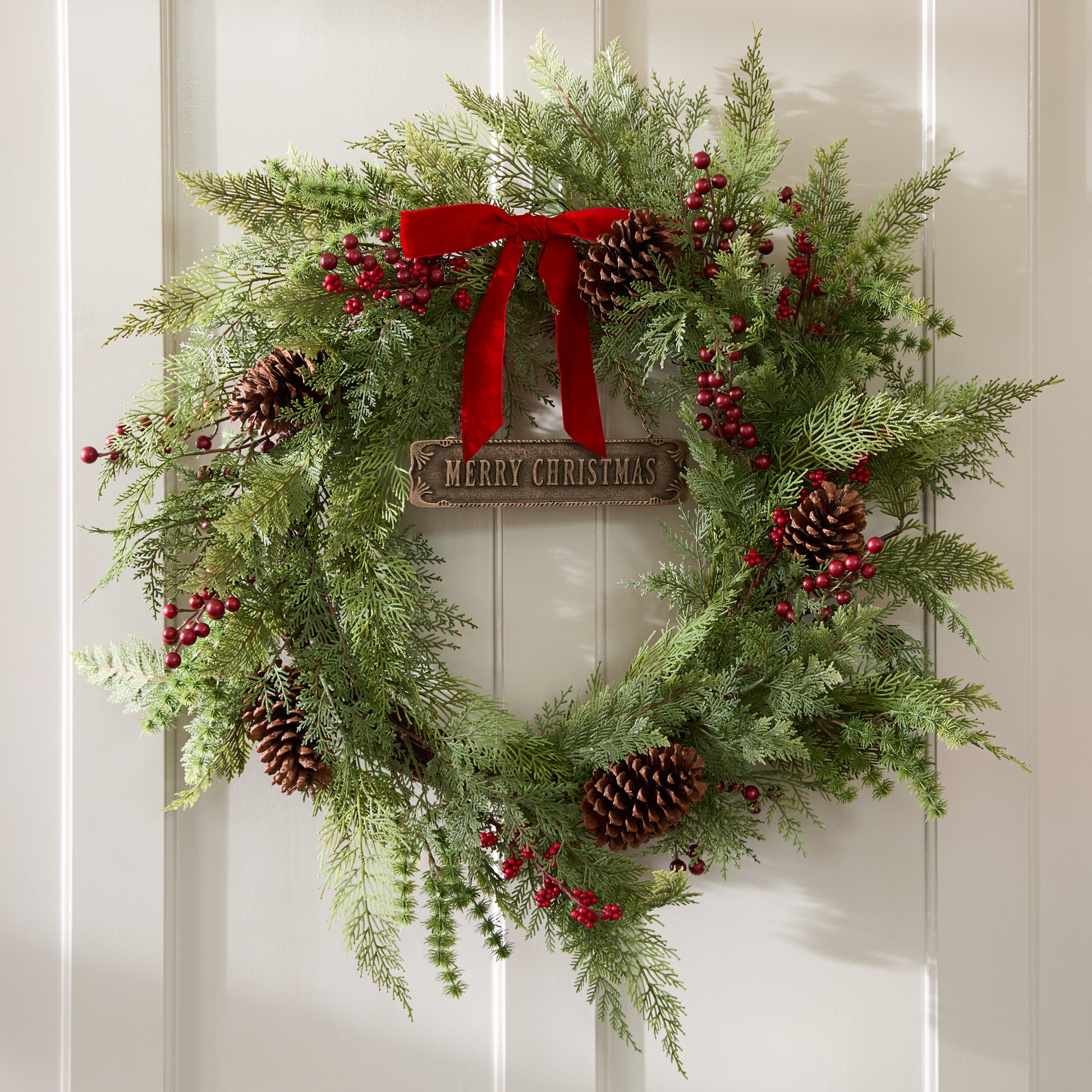 Antique-Inspired Hanging Merry Christmas Sign shown hung with wreath on door