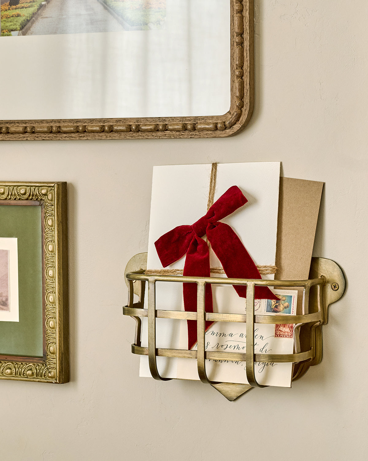 Antiqued Brass Mail Holder with mail in it 