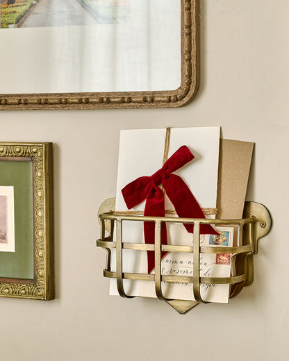 Antiqued Brass Mail Holder with mail in it 