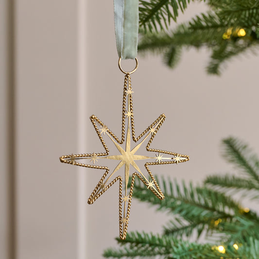 Twisted Brass Star Ornament shown on tree