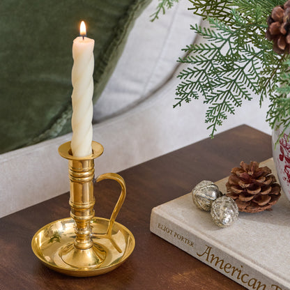 Brass Chamberstick Candle Holder shown with lit candle