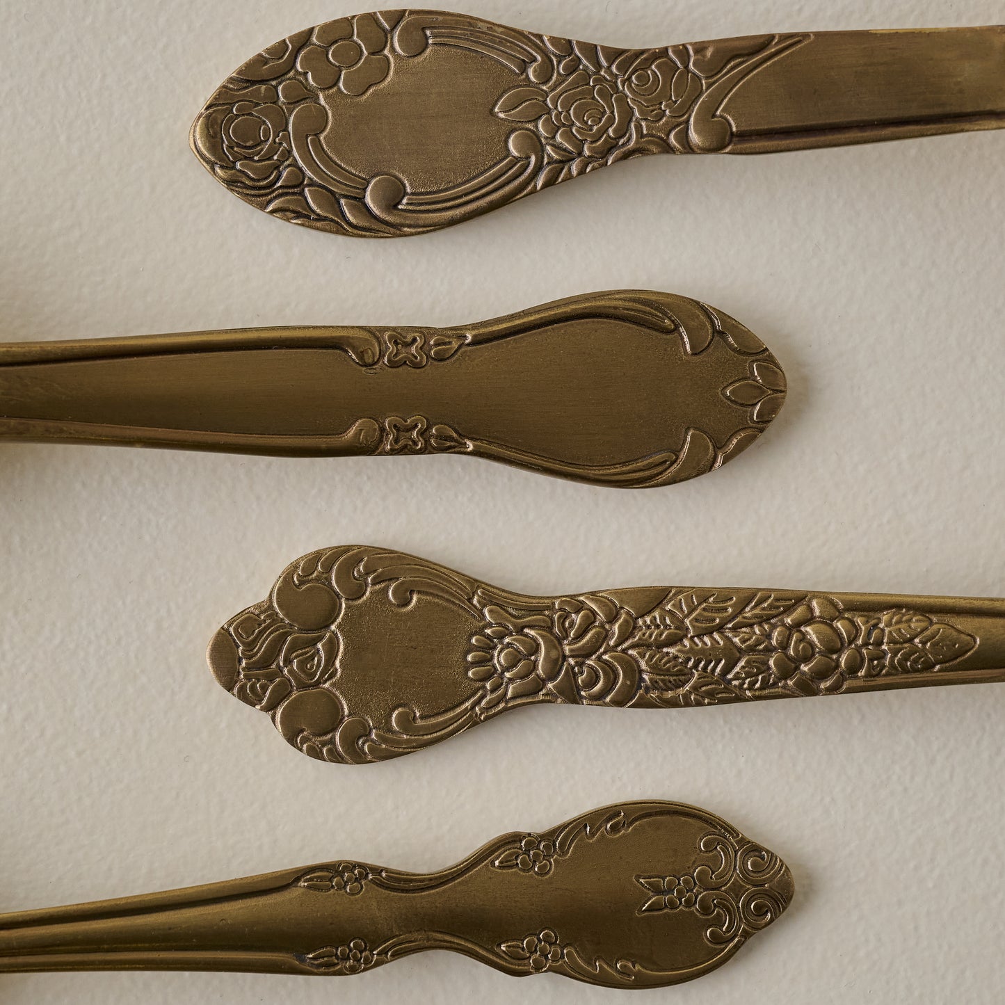 Antique Brass Measuring Spoons handles up close