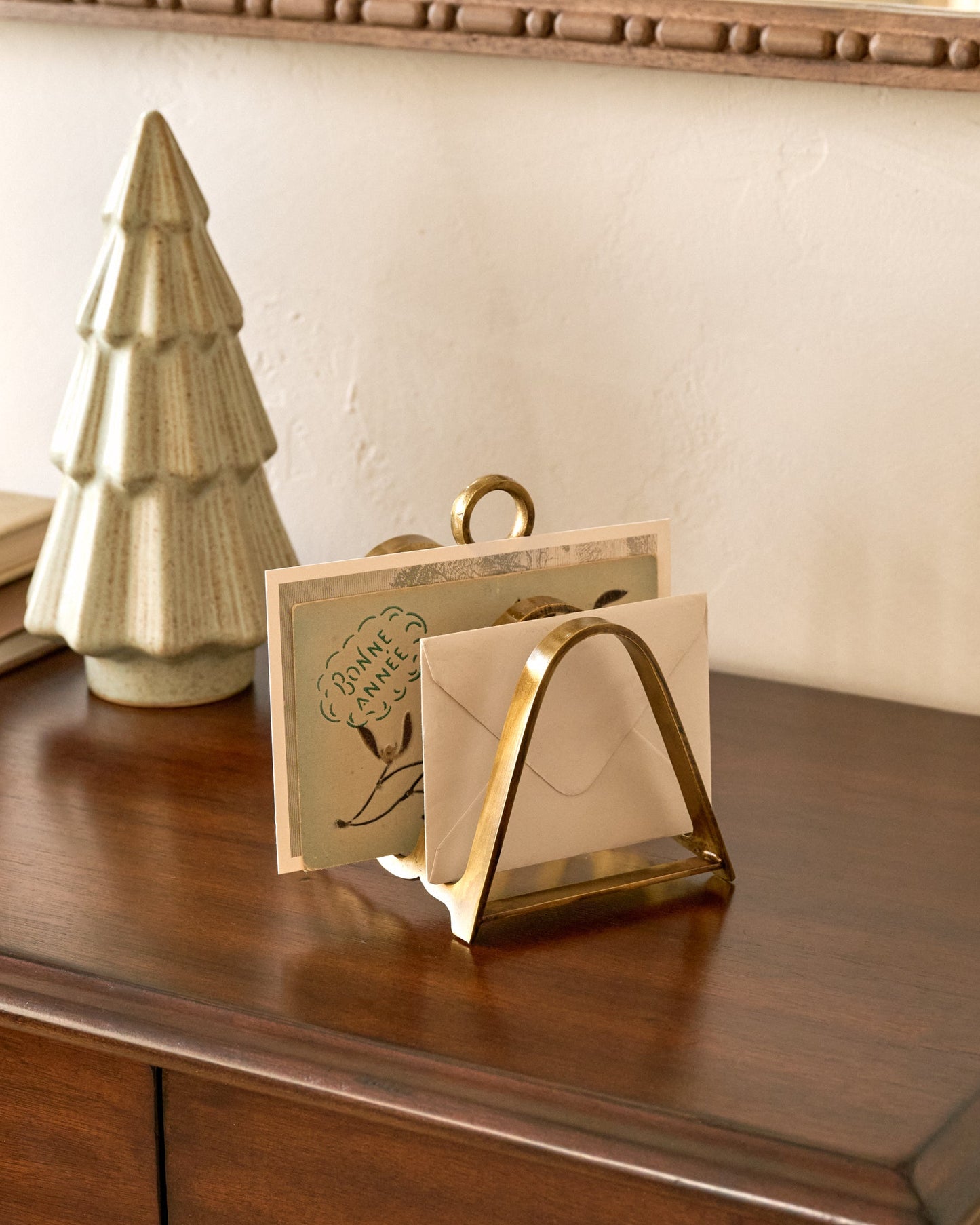 Brass Decorative Card Divider on a table with cards in it