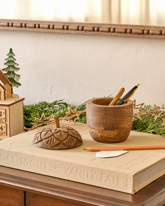 Hand-Carved Wooden Acorn Canister shown holding writing utensils