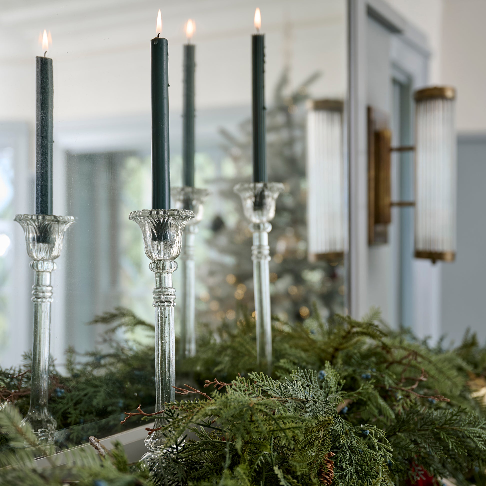 Elsa Antique-Inspired Glass Taper Holders shown on mantel with candles lit
