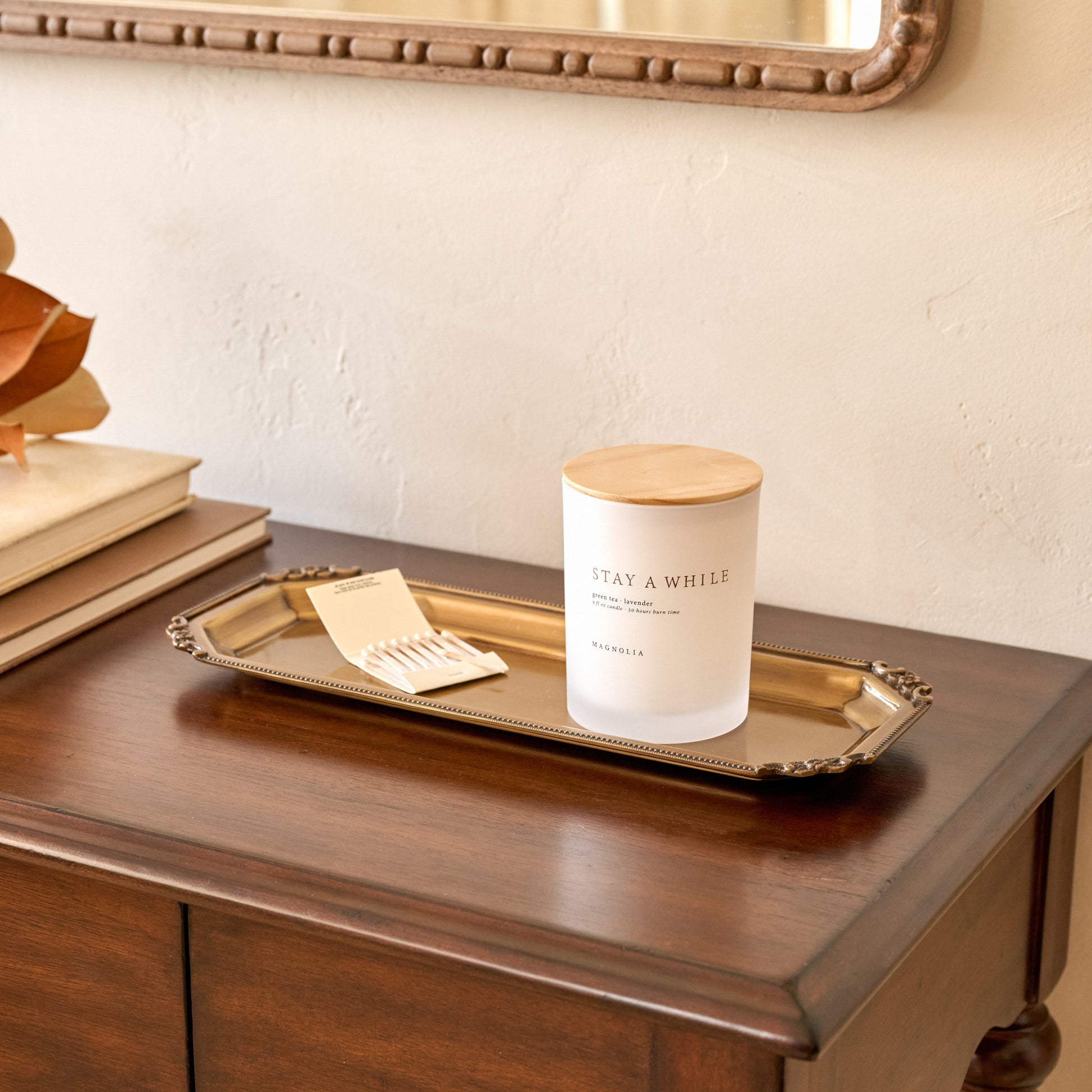 Juliet Antiqued Brass Tray shown with candle on entry table