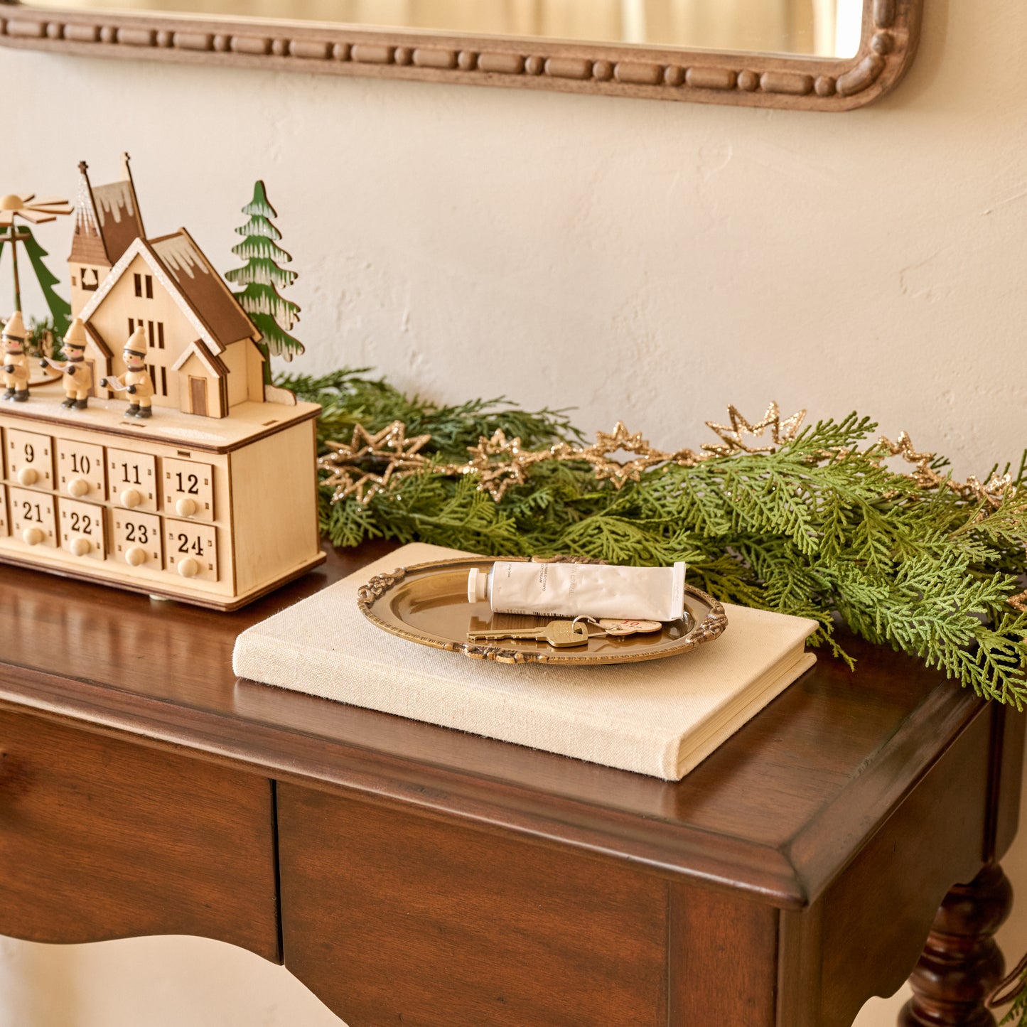 Giselle Antiqued Brass Tray shown on entry table styled with trinkets