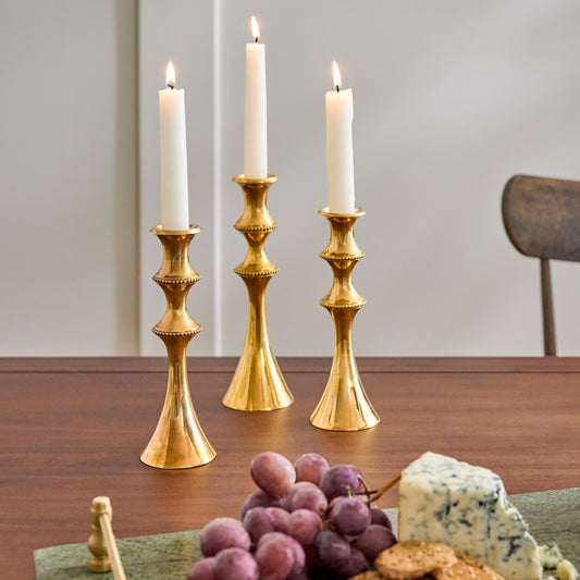 Adler Antiqued Brass Etched Taper Holders shown on dining room table