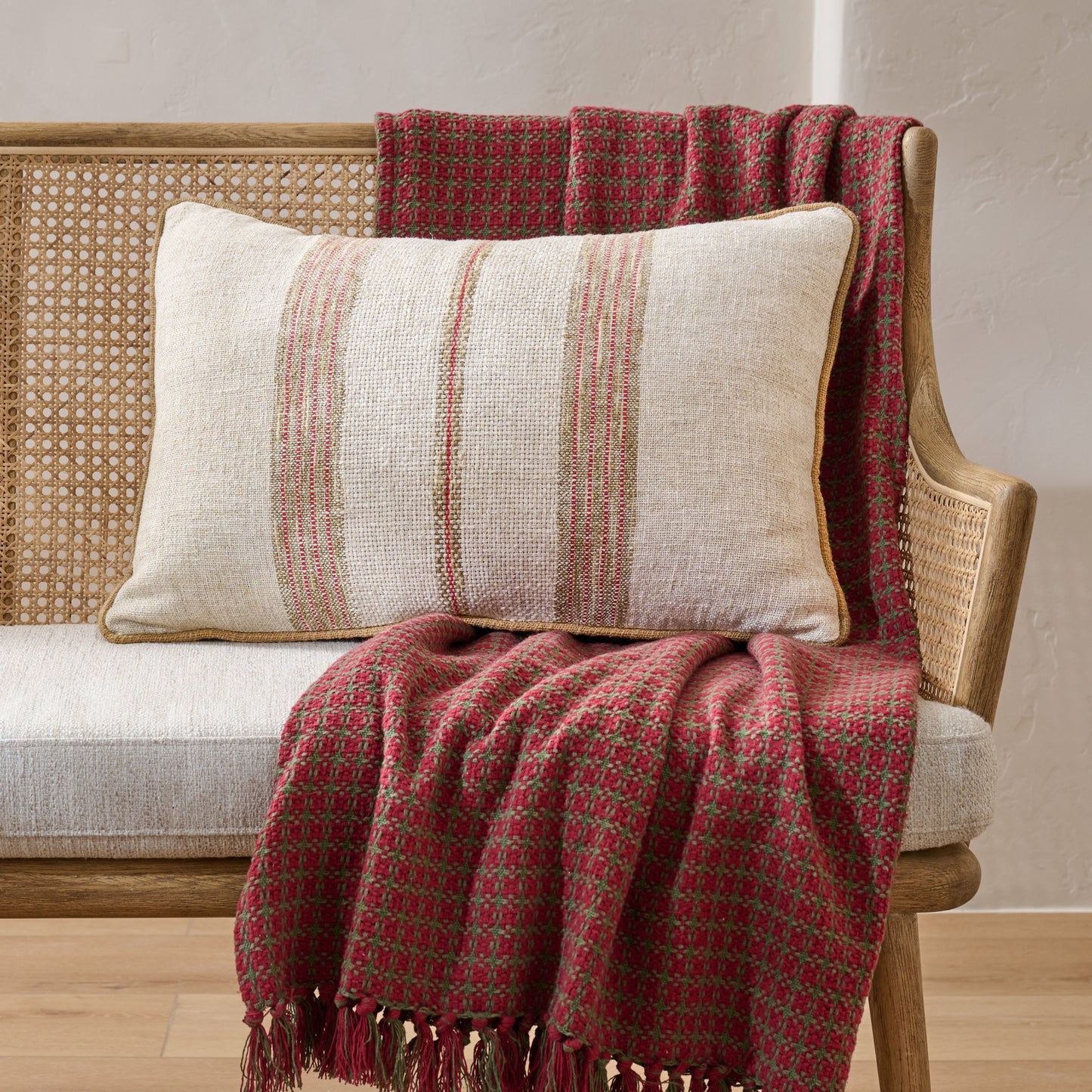 Alpine Stripe Lumbar Pillow shown on bench with throw blanket