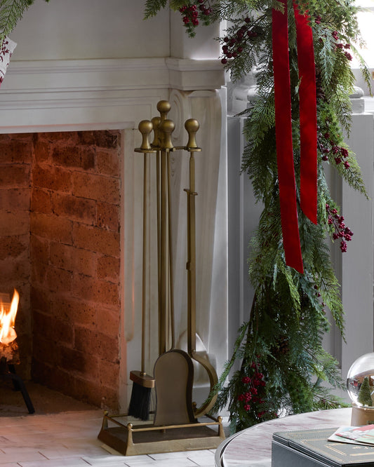 Shepherd Brass Fireplace Toolset shown by fireplace