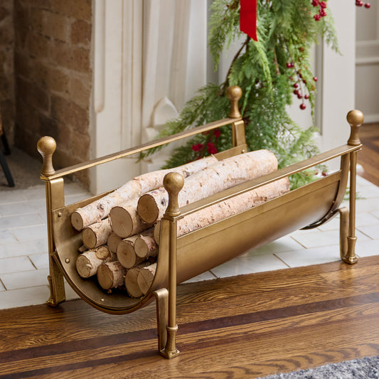 Shepherd Brass Log Holder shown holding logs