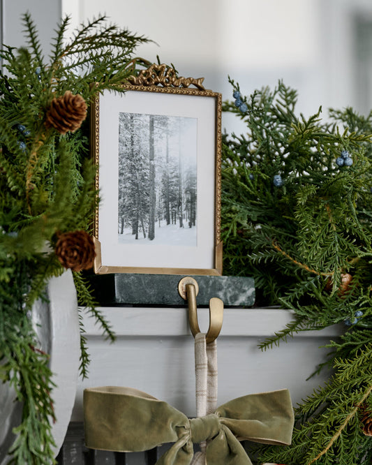 Green Marble Noelle Antique-Inspired Photo Frame Stocking Holder shown on mantel