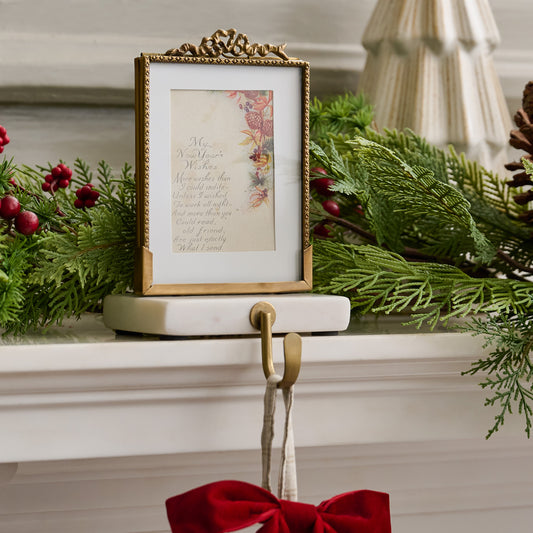 White Marble Noelle Antique-Inspired Photo Frame Stocking Holder shown on mantel