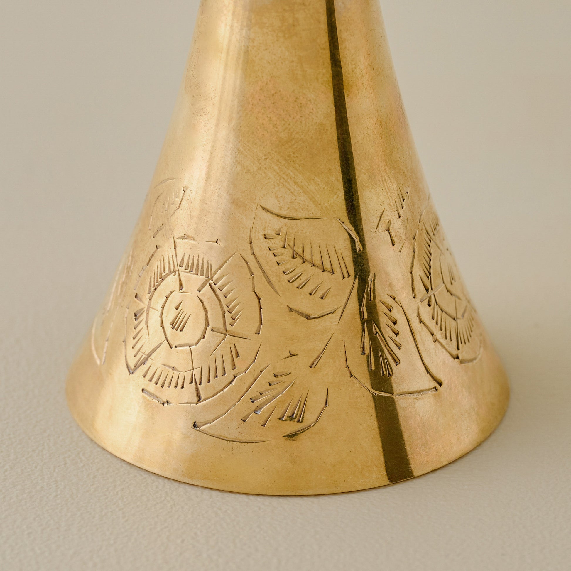 Tall Ava Etched Brass Bell up close